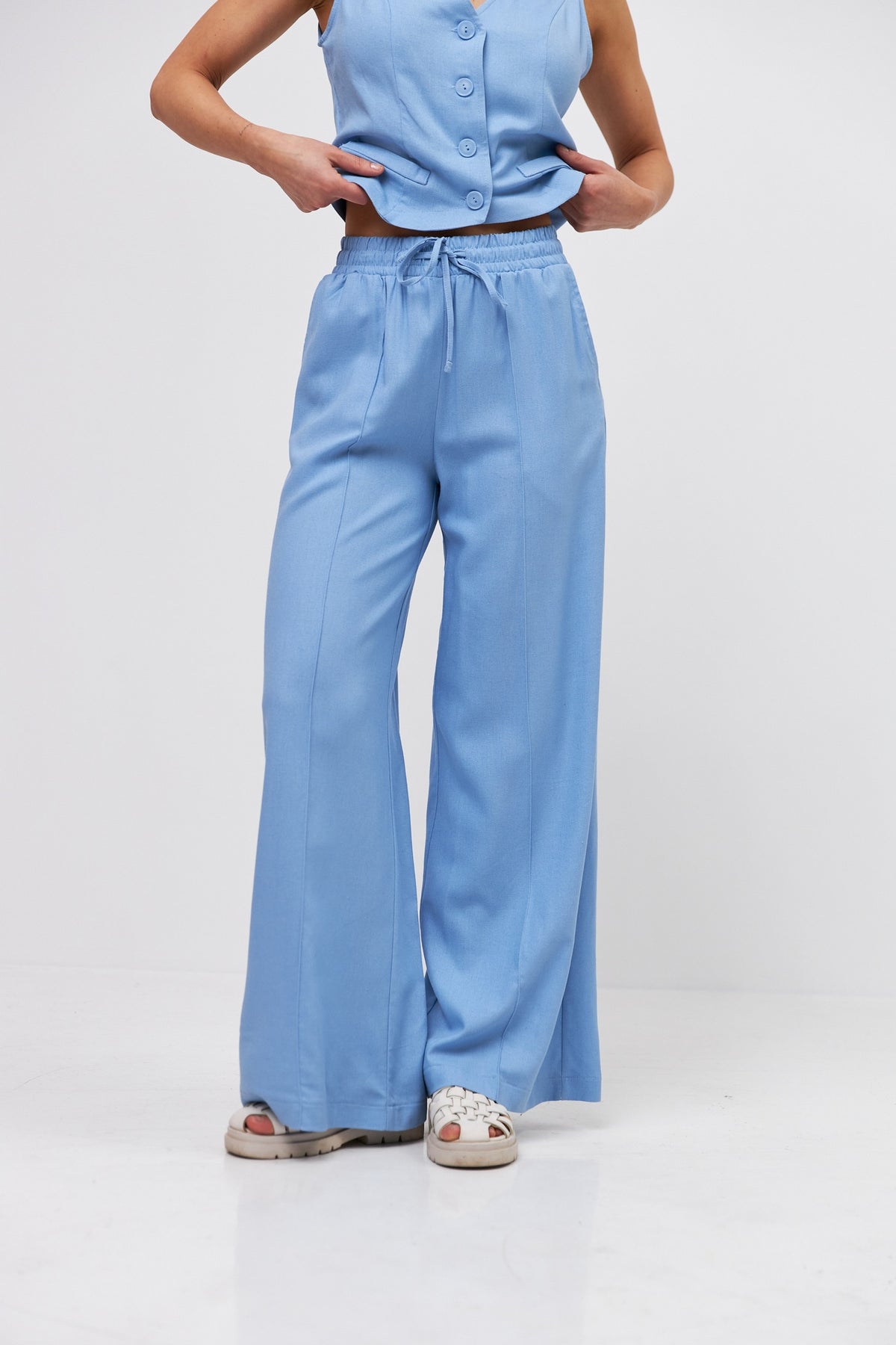 Pantaloni palazzo cu in și talie elastică