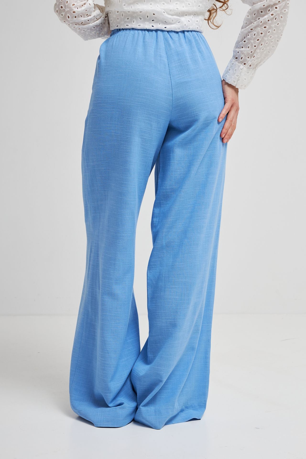 Pantaloni palazzo cu in și talie elastică