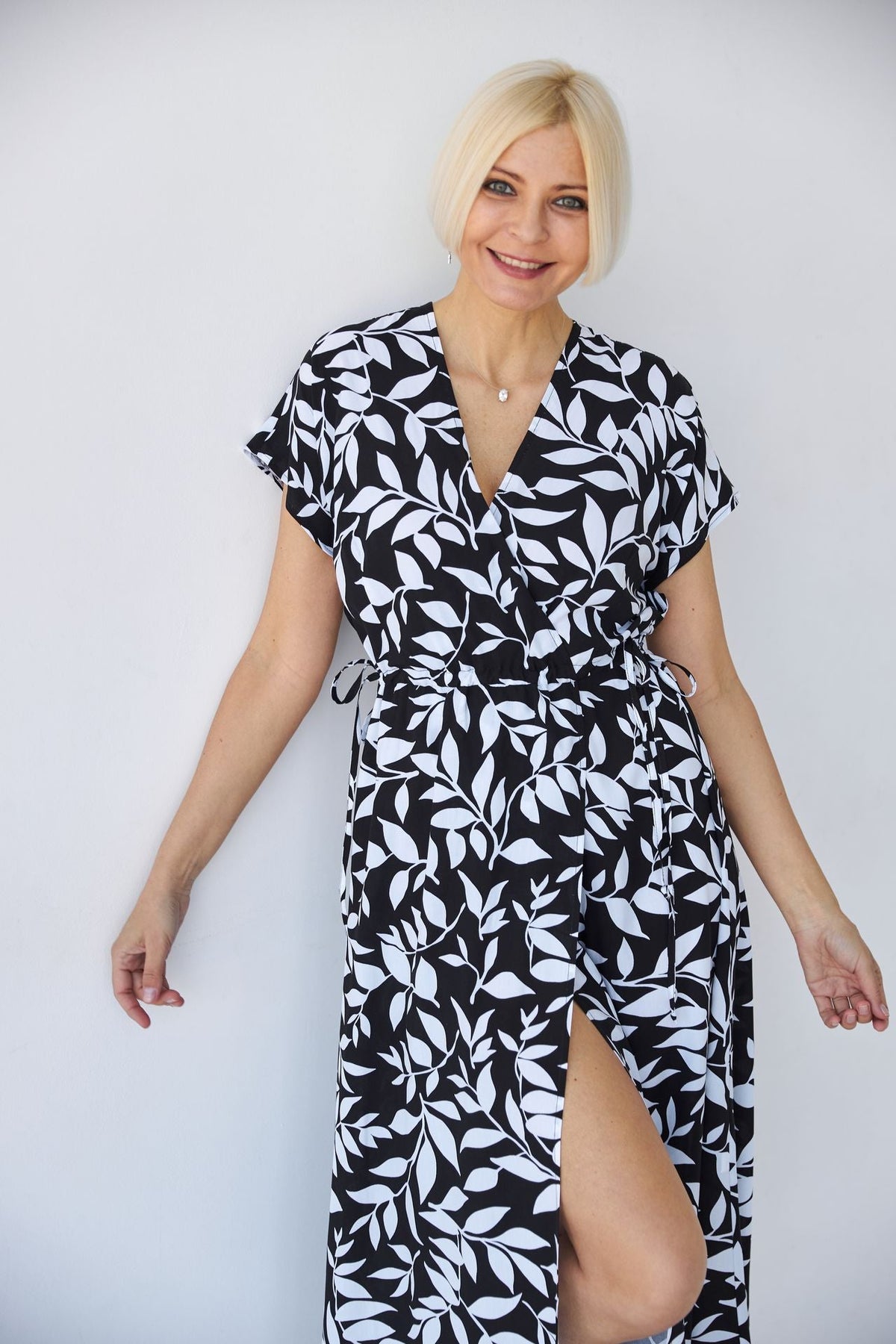 Rochie midi cu bust petrecut și imprimeu floral