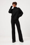 Pantaloni tricotați cu șlițuri